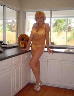 Blonde MILFs posing at home in this..